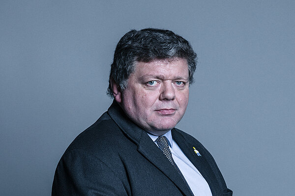 The official portrait of Dominic Addington from the House of Lords.