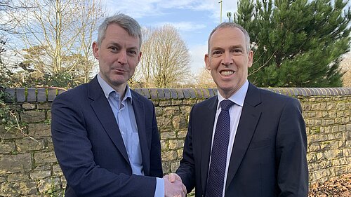 Will Forster and Paul Kennedy shaking hands