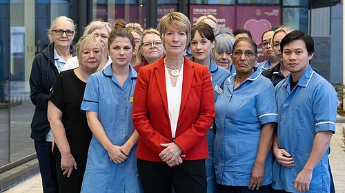 Pippa Heylings, parliamentary candidate for South Cambs, with NHS staff outside hospital