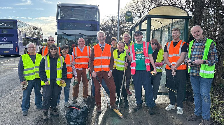 Lib Dem Community Action Team along the A38 cleaning up bus shelters