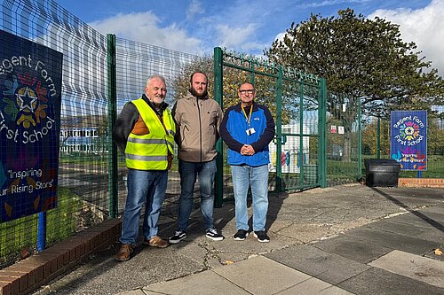 Peter, Rob and John Standing outside of school
