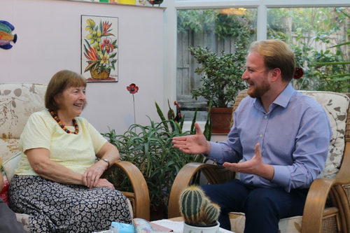 Thomas Gravatt sat down inside talking to a supporter