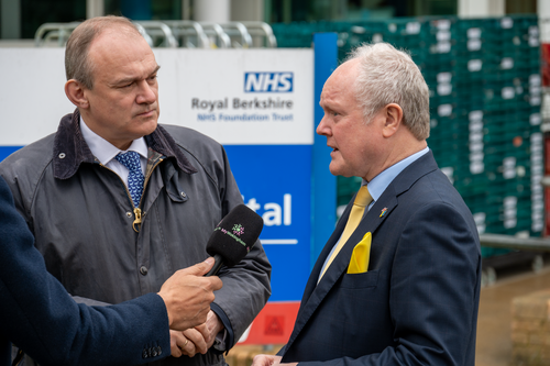 Clive and Ed Davey outside the RBH. Clive is talking into a reporter's microphone