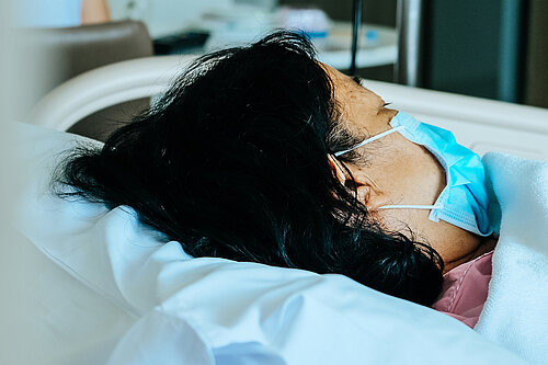 A patient in a hospital bed