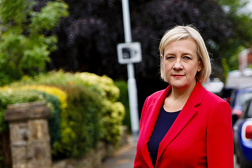 Lisa Smart MP at a speed camera warning sign