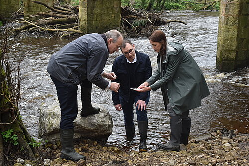 Tom Gordon with Cllr Hannah Gostlow and Ed Davey testing the water in the River Nidd