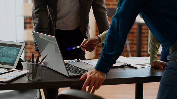 Colleagues working in front of a laptop