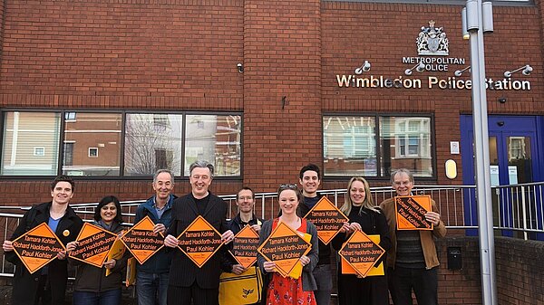 Lib Dems outside Wimbledon policing station