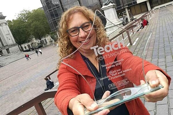 Cllr Suzy Horton holding a Teach Portsmouth award