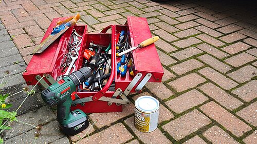 Red toolbox with tools