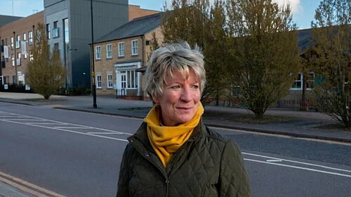 Pippa Heylings beside a road on one of the new housing developments in South Cambs