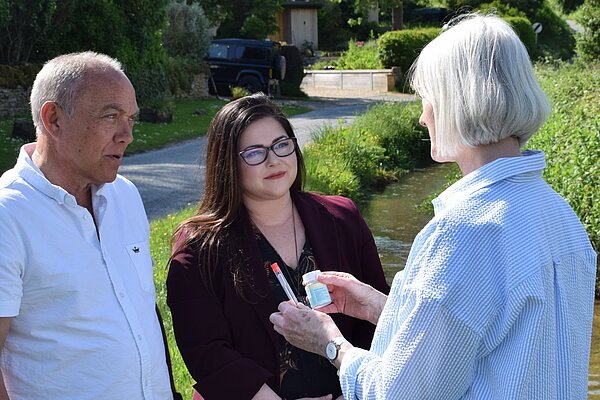 Liz Adams assessing water quality with local councillors.