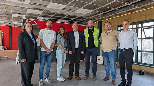 Ian Roome with the bus station team