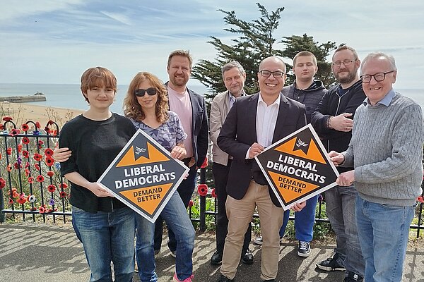 Larry Ngan and Lib Dem Campaigners on The Leas, Folkestone with posters