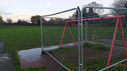 The park would be better served with something like a bench that can be used, rather than a cordoned swing set