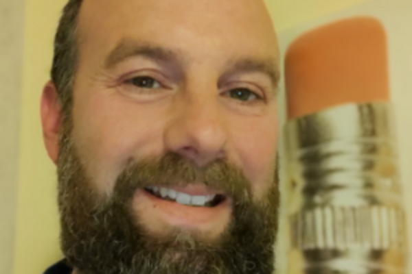 a headshot of Alastair Turner