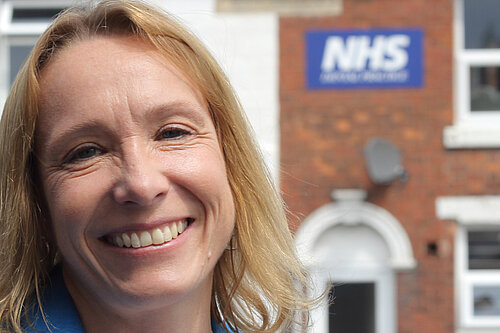 Helen outside an NHS provider