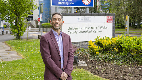 Rodney Berman in front of  University Hospital of Wales